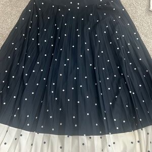 Staple British brand Marks & Spencer mid length pleated skirt in navy and white